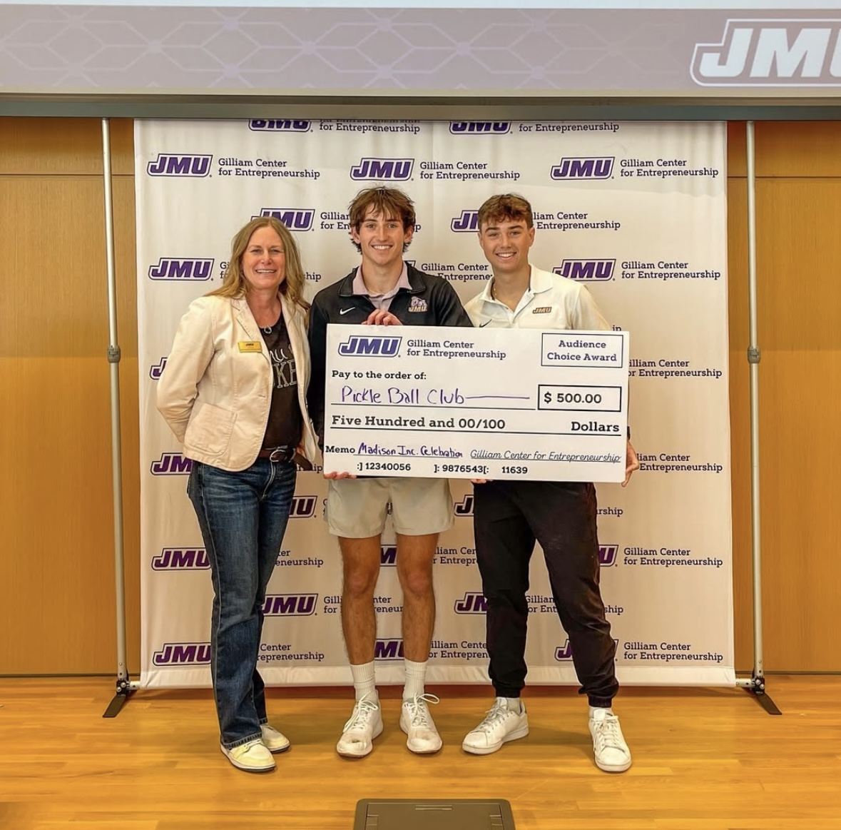 Ryan receiving an award with JMU