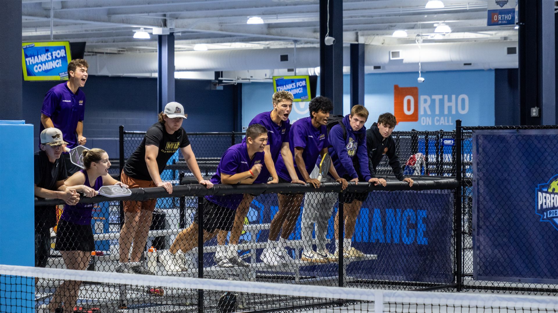 The JMU bench celebrating during a match